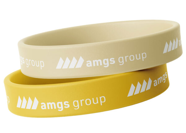 Personalizowane opaski silikonowe w kolorze pastelowego żółtego z nadrukiem. od AMGS Group